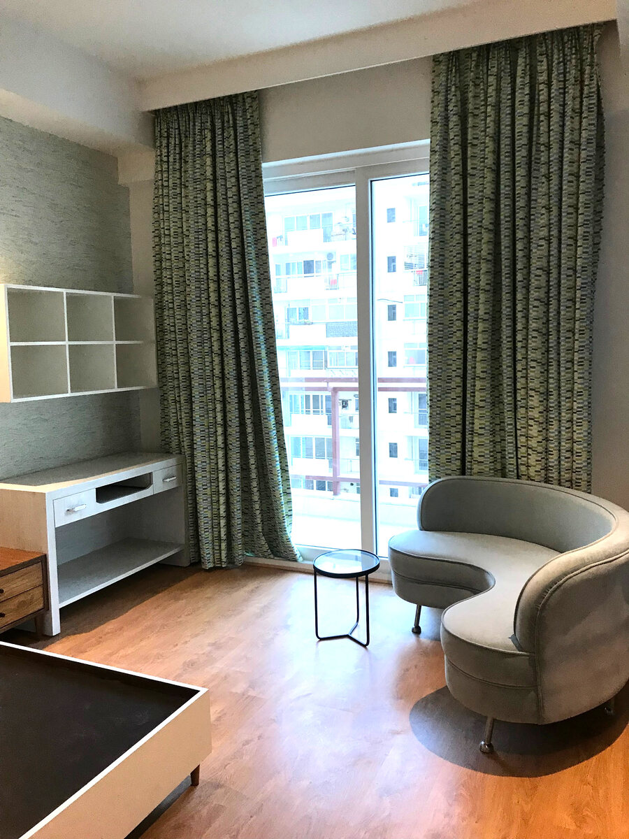 Residential living room with green curtains