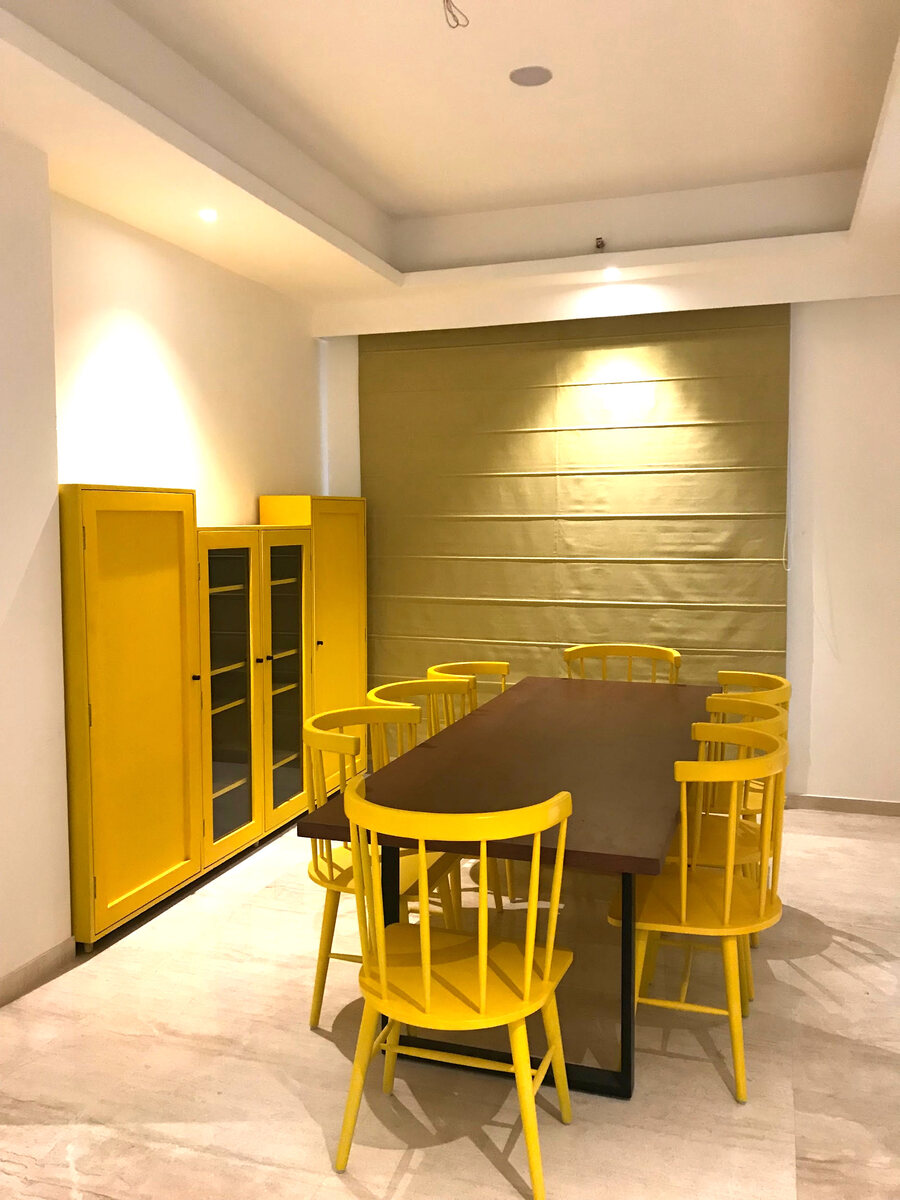 Residential dining area with yellow chairs